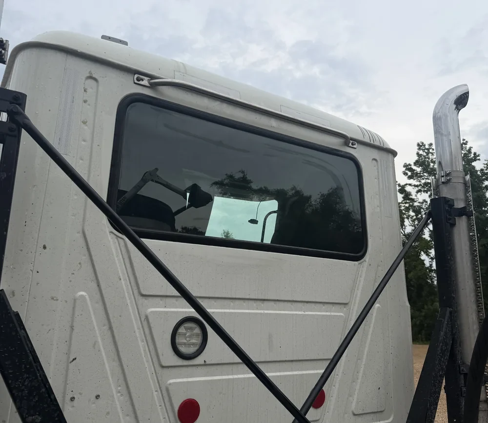 Truck cab rear window. Rear window installed.